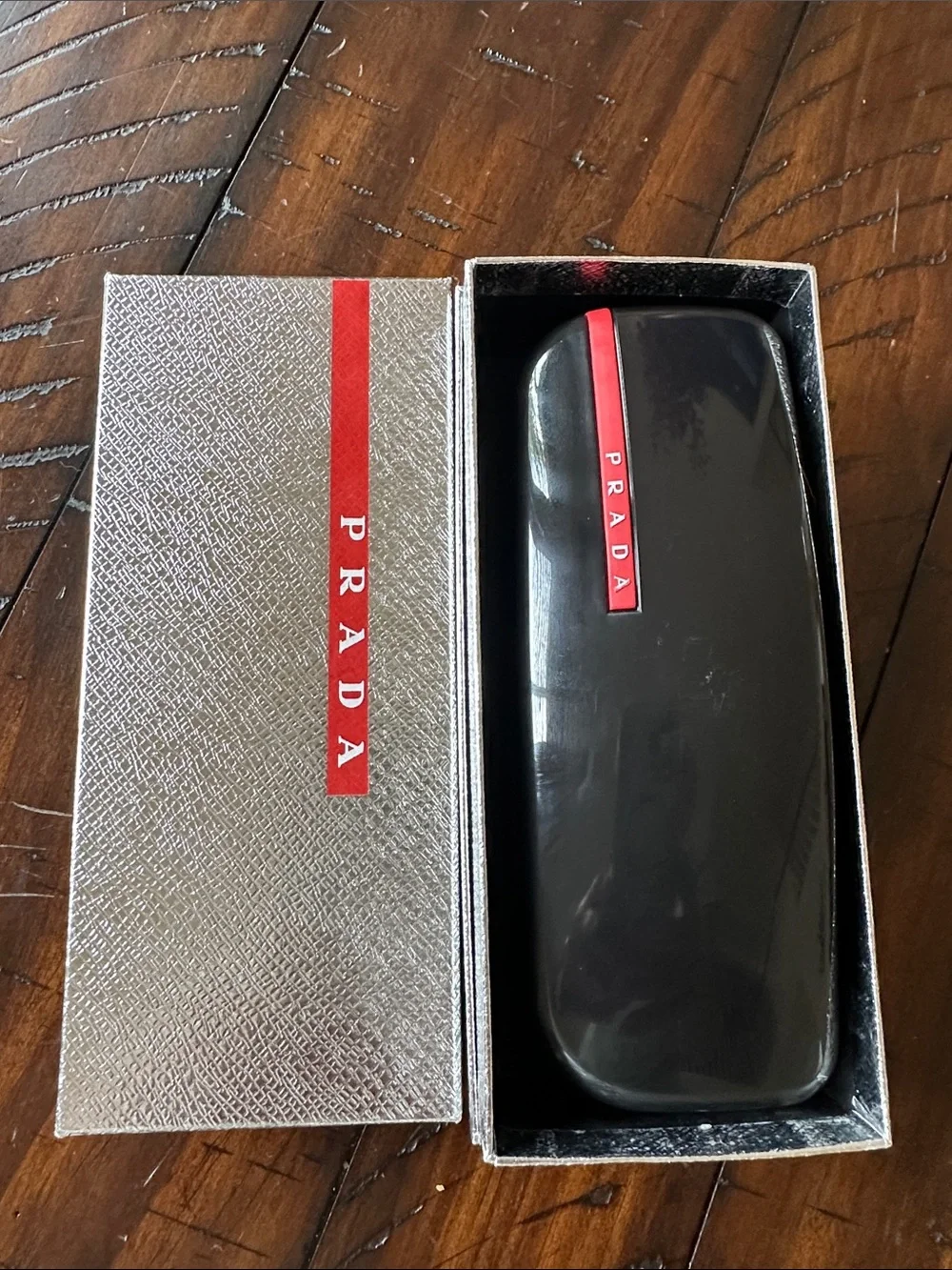 Prada Men’s Black and Silver Rimless Sunglasses